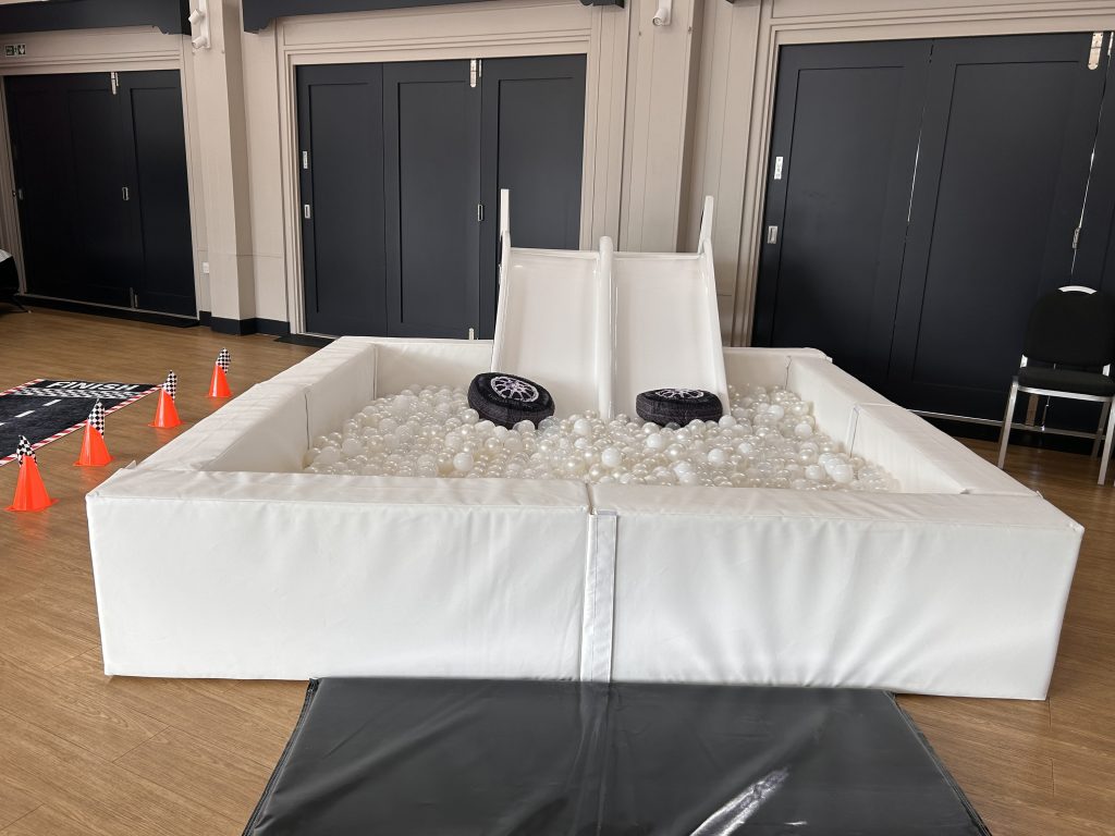 white ball pit and slide