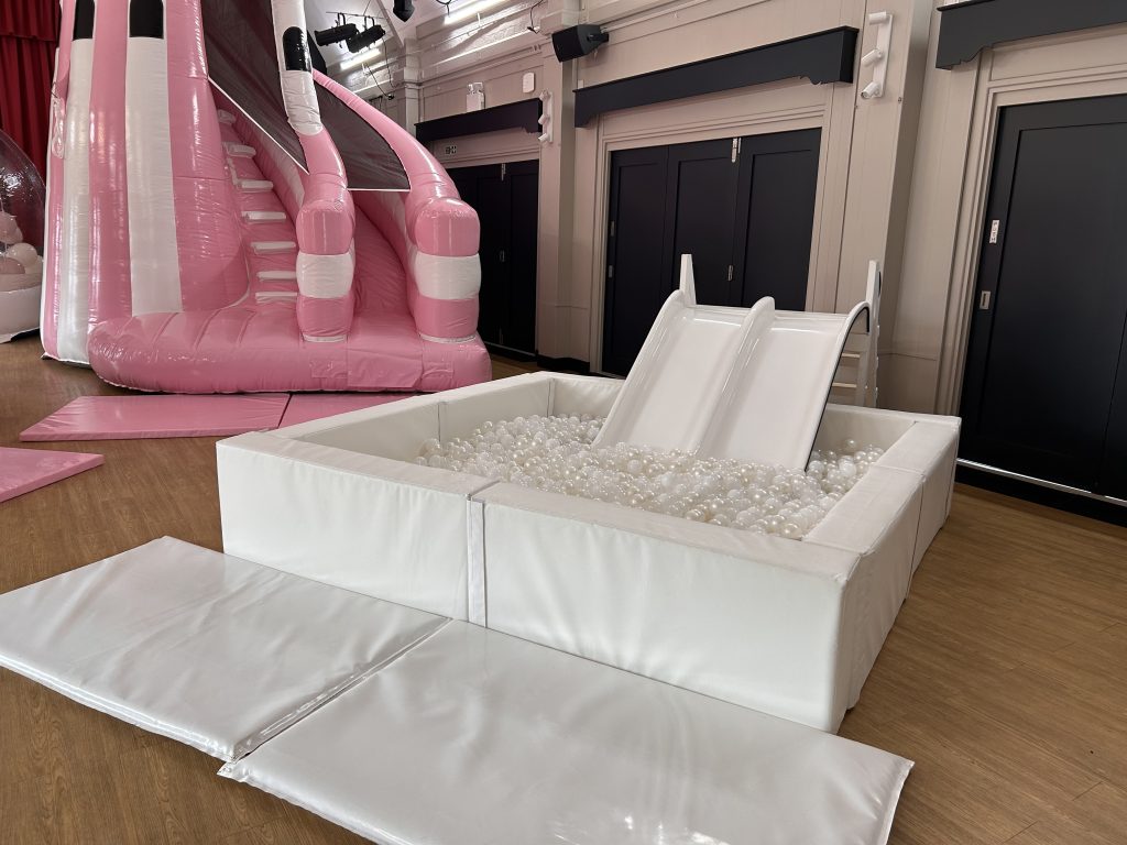white ball pit and slide